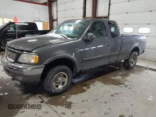2003 Ford F-150 XL with VIN 1FTRX18W63NB69173, listed as a IAAI auction lot 41618645 with 219,506 mi miles. Bid and sale history available at carsss.com. Image 2.
