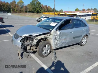 2009 Kia Rio LX with VIN KNADE243696547512, listed as a IAAI auction lot 40639932 with 204,809 mi miles. Bid and sale history available at carsss.com. Image 2.