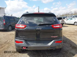2014 Jeep Cherokee Trailhawk with VIN 1C4PJMBS6EW100500, listed as a IAAI auction lot 41894989 with 131,034 mi miles. Bid and sale history available at carsss.com. Image 16.