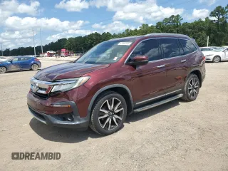2019 Honda Pilot Touring 7-Passenger with VIN 5FNYF6H68KB029053, listed as a Copart auction lot 62646185 with 133,855 mi miles and Salvage title. Bid and sale history available at DreamBid. Image 1.