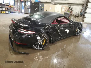 2019 Porsche 911 Turbo S with VIN WP0CD2A9XKS144611, listed as a Copart auction lot 77636924 with 62,657 mi miles and Salvage Title. Bid and sale history available at carsss.com. Image 3.