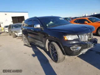 2017 Jeep Grand Cherokee Overland with VIN 1C4RJECGXHC659417, listed as a Copart auction lot 80168894 with 118,934 mi miles and Salvage Title. Bid and sale history available at carsss.com. Image 4.