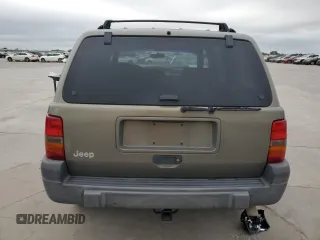 1998 Jeep Grand Cherokee Laredo with VIN 1J4FX58S0WC337066, listed as a Copart auction lot 69125414 with 0 mi miles and Salvage Title. Bid and sale history available at carsss.com. Image 6.