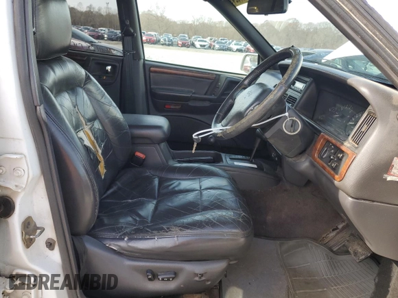 1996 Jeep Grand Cherokee Limited с VIN 1J4GZ78S2TY123592, выставлен на аукционе Copart как лот 84387624 с пробегом Не указан миль и Списание • Salvage title. История ставок и продаж доступна на DreamBid. Изображение 7.
