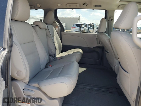 2015 Toyota Sienna XLE with VIN 5TDYK3DC4FS619385, listed as a Copart auction lot 57090385 with 112,896 mi miles and Salvage title. Bid and sale history available at DreamBid. Image 11.