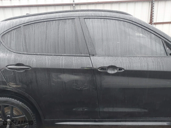 2021 Alfa Romeo Stelvio Ti with VIN ZASPAKBN0M7D02795, listed as a IAAI auction lot 41052309 with 83,584 mi miles. Bid and sale history available at carsss.com. Image 14.