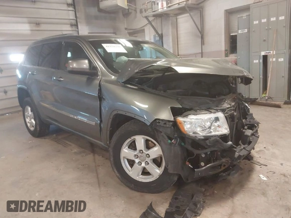 2012 Jeep Grand Cherokee Laredo with VIN 1C4RJFAG3CC209142, listed as a IAAI auction lot 41978296 with 201,796 mi miles. Bid and sale history available at carsss.com. Image 1.