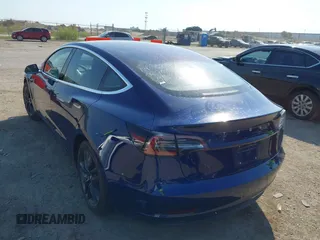 2018 Tesla Model 3 Long Range Battery with VIN 5YJ3E1EA6JF027065, listed as a IAAI auction lot 40532631 with 55,316 mi miles. Bid and sale history available at carsss.com. Image 3.