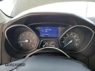 2013 Ford Focus SE z VIN 1FADP3F26DL106275, wystawiony jako Copart lot #55701345 z przebiegiem 117 897 mil mil oraz Szkody całkowita. Historia ofert i sprzedaży dostępna na DreamBid. Obrazek 9.