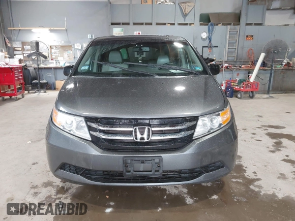 2012 Honda Odyssey EX-L with VIN 5FNRL5H63CB137198, listed as a IAAI auction lot 42706690 with 305,753 mi miles and . Bid and sale history available at DreamBid. Image 12.
