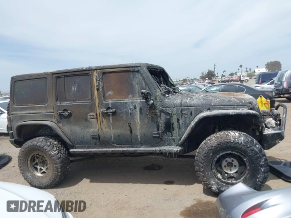 2016 Jeep Wrangler Unlimited Sahara z VIN 1C4HJWEG4GL261147, wystawiony jako IAAI lot #42239252 z przebiegiem 69 604 mil mil oraz . Historia ofert i sprzedaży dostępna na DreamBid. Obrazek 13.