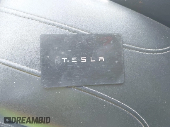 2022 Tesla Model 3 Long Range with VIN 5YJ3E1EB0NF106570, listed as a IAAI auction lot 41832622 with 52,679 mi miles and . Bid and sale history available at DreamBid. Image 11.