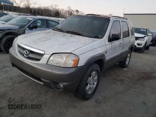 2003 Mazda Tribute LX with VIN 4F2YZ94133KM20084, listed as a Copart auction lot 82598104 with 216,848 mi miles and Salvage Title. Bid and sale history available at carsss.com. Image 1.