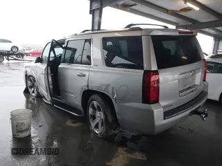 2015 Chevrolet Tahoe LTZ with VIN 1GNSCCKC5FR123099, listed as a IAAI auction lot 41391974 with Not provided miles and . Bid and sale history available at DreamBid. Image 3.