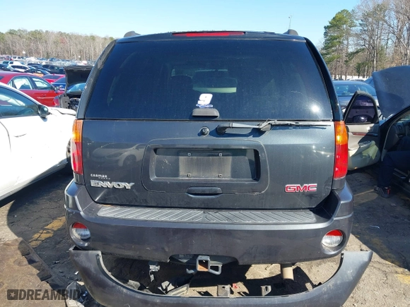 2005 GMC Envoy SLE with VIN 1GKDS13S252305661, listed as a IAAI auction lot 41751800 with 235,090 mi miles. Bid and sale history available at carsss.com. Image 16.