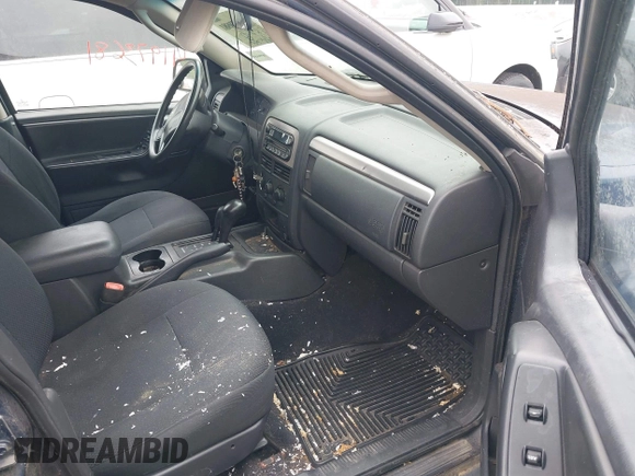 2003 Jeep Grand Cherokee Laredo with VIN 1J4GW48S63C591605, listed as a IAAI auction lot 42389898 with 177,024 mi miles and . Bid and sale history available at DreamBid. Image 5.