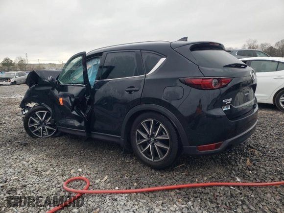 2018 Mazda CX-5 Grand Touring z VIN JM3KFBDM0J0403095, wystawiony jako Copart lot #48594495 z przebiegiem Nie podano mil oraz Szkoda całkowita • Salvage title. Historia ofert i sprzedaży dostępna na DreamBid. Obrazek 2.