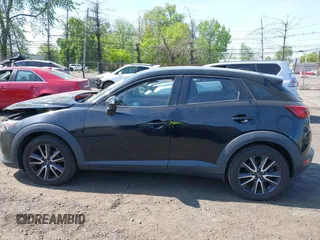 2018 Mazda CX-3 Touring z VIN JM1DKDC70J0329410, wystawiony jako IAAI lot #42137391 z przebiegiem 86 013 mil mil oraz . Historia ofert i sprzedaży dostępna na DreamBid. Obrazek 14.