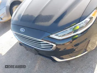 2019 Ford Fusion SEL with VIN 3FA6P0MU5KR203851, listed as a IAAI auction lot 41982637 with 96,954 mi miles and . Bid and sale history available at DreamBid. Image 6.