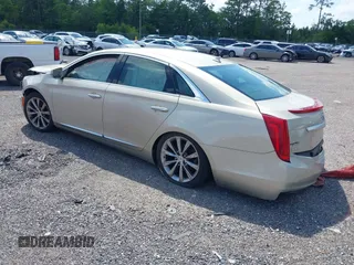 2014 Cadillac XTS z VIN 2G61L5S39E9159583, wystawiony jako IAAI lot #36024597 z przebiegiem 118 461 mil mil oraz . Historia ofert i sprzedaży dostępna na DreamBid. Obrazek 3.