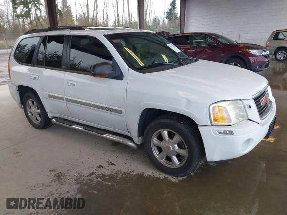 2003 GMC Envoy SLE with VIN 1GKDT13SX32319740, listed as a IAAI auction lot 41923578 with 210,811 mi miles. Bid and sale history available at carsss.com. Image 1.