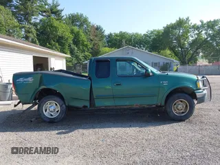 1999 Ford F-150 with VIN 1FTRX18W4XNA50527, listed as a IAAI auction lot 42563746 with 213,959 mi miles and . Bid and sale history available at DreamBid. Image 14.
