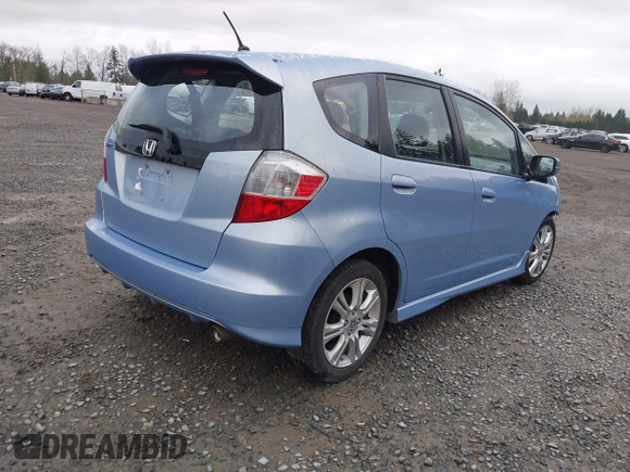 2009 Honda Fit Sport w/Navi with VIN JHMGE886X9S042490, listed as a IAAI auction lot 41931712 with 111,088 mi miles. Bid and sale history available at carsss.com. Image 4.