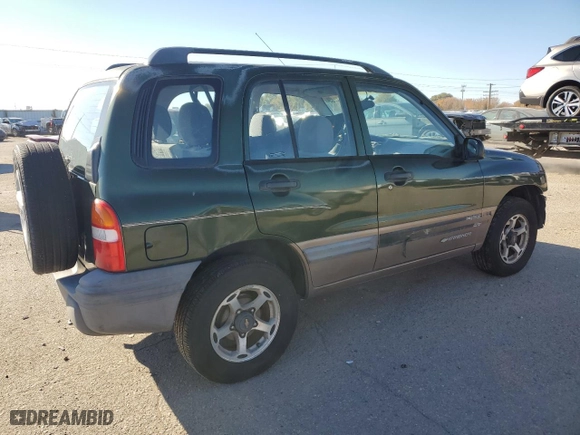 2000 Chevrolet Tracker with VIN 2CNBJ13C7Y6902998, listed as a Copart auction lot 78647054 with 141470 miles and Salvage Title. Bid and sale history available at carsss.com. Image 3.