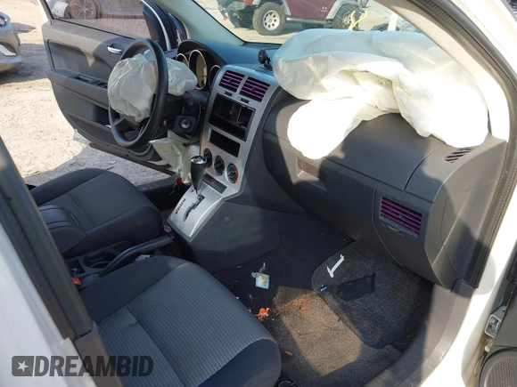 2009 Dodge Caliber SXT with VIN 1B3HB48A69D130857, listed as a IAAI auction lot 41526199 with 163,796 mi miles and . Bid and sale history available at DreamBid. Image 5.