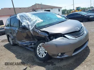 2014 Toyota Sienna XLE with VIN 5TDYK3DC8ES451829, listed as a IAAI auction lot 42689122 with 104,729 mi miles and . Bid and sale history available at DreamBid. Image 1.