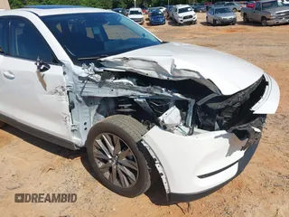 2021 Mazda CX-5 Grand Touring with VIN JM3KFBDM3M0493752, listed as a IAAI auction lot 42456854 with 35,122 mi miles and . Bid and sale history available at DreamBid. Image 6.