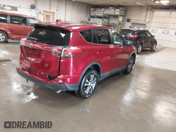 2018 Toyota RAV4 LE with VIN 2T3BFREV9JW825953, listed as a IAAI auction lot 42463780 with 74,128 mi miles and . Bid and sale history available at DreamBid. Image 4.