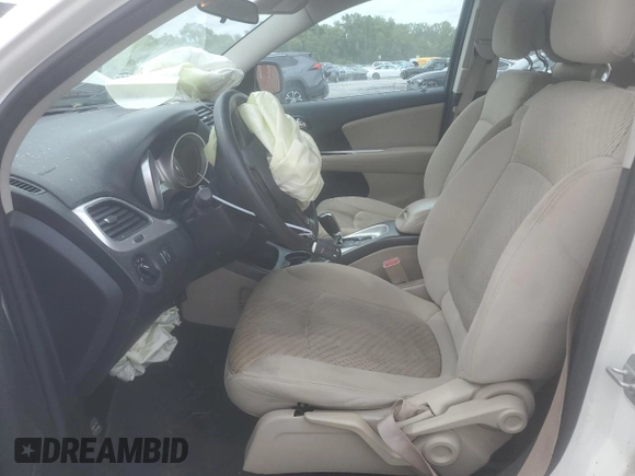 2013 Dodge Journey American Value with VIN 3C4PDCAB3DT516477, listed as a Copart auction lot 56129035 with 181,077 mi miles and Salvage title. Bid and sale history available at DreamBid. Image 7.