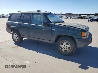 1995 Jeep Grand Cherokee Laredo with VIN 1J4FX58S5SC741328, listed as a Copart auction lot 82034594 with 260,398 mi miles and Clean Title. Bid and sale history available at carsss.com. Image 4.