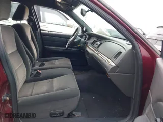 2004 Ford Crown Victoria LX with VIN 2FAFP74W14X128791, listed as a IAAI auction lot 41405101 with 137,091 mi miles. Bid and sale history available at carsss.com. Image 5.