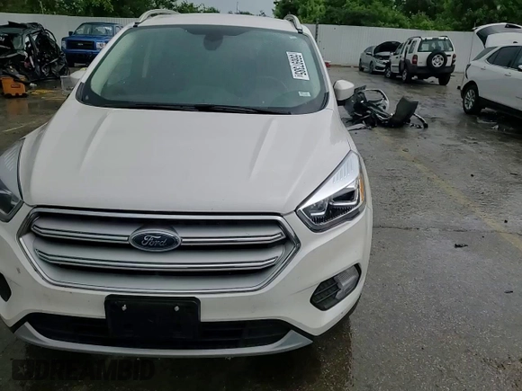 2018 Ford Escape Titanium z VIN 1FMCU9J94JUB49827, wystawiony jako Copart lot #55697385 z przebiegiem 98 682 mil mil oraz Szkoda całkowita • Salvage title. Historia ofert i sprzedaży dostępna na DreamBid. Obrazek 15.
