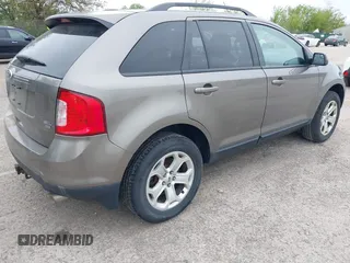 2014 Ford Edge SEL z VIN 2FMDK4JC1EBA03356, wystawiony jako IAAI lot #42304387 z przebiegiem 229 763 mil mil oraz . Historia ofert i sprzedaży dostępna na DreamBid. Obrazek 4.
