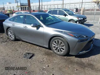 2022 Toyota Mirai XLE z VIN JTDAAAAA2NA007614, wystawiony jako IAAI lot #41537556 z przebiegiem 12 155 mil mil oraz . Historia ofert i sprzedaży dostępna na DreamBid. Obrazek 1.