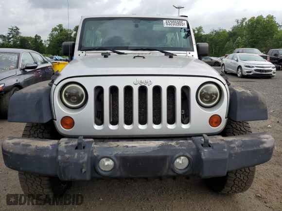 2012 Jeep Wrangler Sport с VIN 1C4AJWAG9CL157805, выставлен на аукционе Copart как лот 65205905 с пробегом 249 221 миль миль и Чистый • Clean title. История ставок и продаж доступна на DreamBid. Изображение 5.
