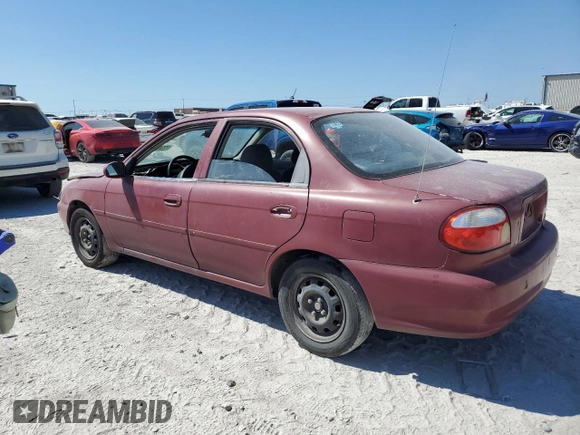 2001 Kia Sephia z VIN KNAFB121115074609, wystawiony jako Copart lot #72346144 z przebiegiem 88 400 mil mil oraz Czysty tytuł • Clean title. Historia ofert i sprzedaży dostępna na DreamBid. Obrazek 2.