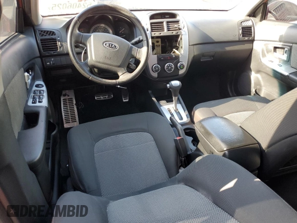 2009 Kia Spectra EX with VIN KNAFE222995027376, listed as a Copart auction lot 52406025 with 73,692 mi miles and Salvage Title. Bid and sale history available at DreamBid. Image 8.