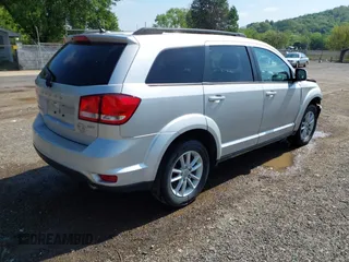 2013 Dodge Journey SXT z VIN 3C4PDCBG4DT564290, wystawiony jako IAAI lot #42225485 z przebiegiem 69 029 mil mil oraz . Historia ofert i sprzedaży dostępna na DreamBid. Obrazek 4.