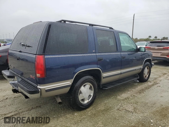 1999 GMC Yukon with VIN 1GKEK13R2XJ739931, listed as a Copart auction lot 74583734 with 115,605 mi miles and Salvage Title. Bid and sale history available at carsss.com. Image 3.