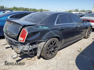 2013 Chrysler 300 SRT-8 with VIN 2C3CCAFJ9DH731557, listed as a Copart auction lot 69700344 with 174,242 mi miles and Salvage Title. Bid and sale history available at DreamBid. Image 3.