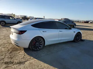 2023 Tesla Model 3 Performance z VIN 5YJ3E1EC3PF556807, wystawiony jako Copart lot #46990175 z przebiegiem Nie podano mil oraz Nie do naprawy • Non repairable. Historia ofert i sprzedaży dostępna na DreamBid. Obrazek 3.