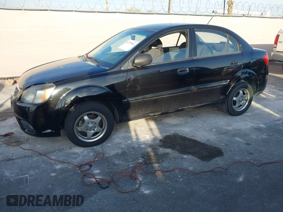 2010 Kia Rio LX with VIN KNADH4A33A6668719, listed as a IAAI auction lot 41777544 with 124,400 mi miles. Bid and sale history available at carsss.com. Image 6.