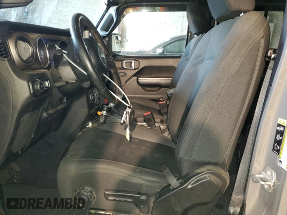 2020 Jeep Wrangler Unlimited Black and Tan with VIN 1C4HJXDG9LW331418, listed as a Copart auction lot 56414765 with 125,339 mi miles and Salvage title. Bid and sale history available at DreamBid. Image 7.