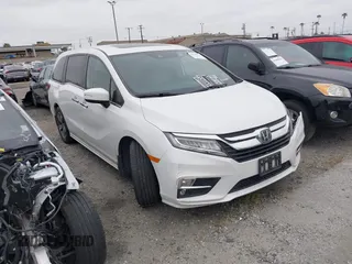2020 Honda Odyssey Touring with VIN 5FNRL6H81LB028083, listed as a IAAI auction lot 42003810 with 71,536 mi miles and . Bid and sale history available at DreamBid. Image 1.