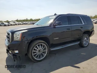 2016 GMC Yukon SLT with VIN 1GKS1BKCXGR122111, listed as a Copart auction lot 69900124 with 73,781 mi miles and Salvage Title. Bid and sale history available at carsss.com. Image 1.