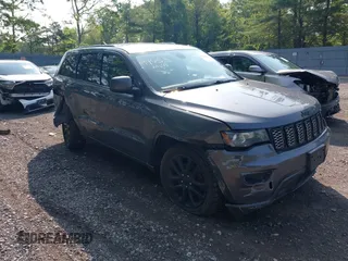 2017 Jeep Grand Cherokee Altitude with VIN 1C4RJFAG4HC807439, listed as a IAAI auction lot 42468652 with 149,807 mi miles and . Bid and sale history available at DreamBid. Image 1.